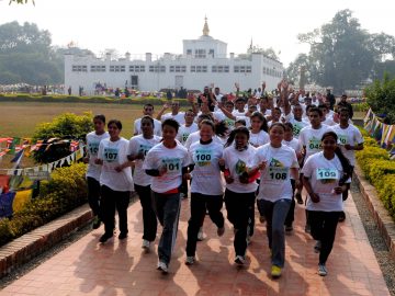 Participants of Lumbini Marathon runs in front of the  Maya devi temple at Lumbini on Tuesday, Janaury 15 2013. More than 250 runner participants in five categories . The Marathon was held  at the birth place of lord  Gautam Buddha to promote  Nepal as a destination of world peace . According to Bikram Pandey the organizer of Lumbini Marathon They aim to  promote Lumbini as the best  holyday destination thourgh tourism and its also promte for world peace . The Slogan of the marathon was "Run for peace, Run for Buddha, Run for Tourism and Run for Enlightment.